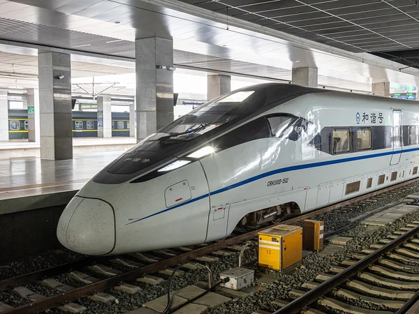 A high-speed train at an operating railway station in Shanghai A high-speed train at an operating railway station in Shanghai