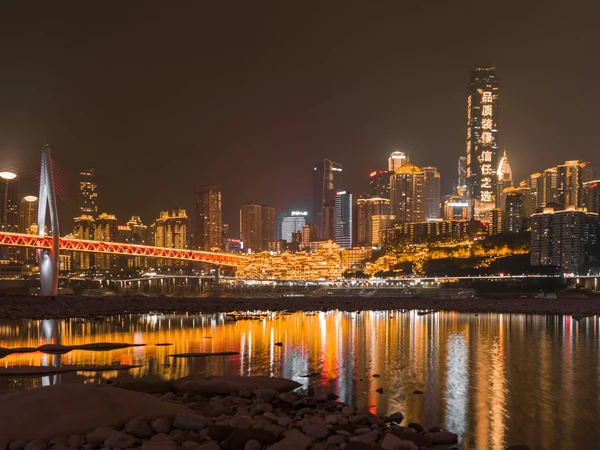 Hongya Cave and Qiansimen Bridge illuminated at night in Chongqing Hongya Cave and Qiansimen Bridge illuminated at night in Chongqing