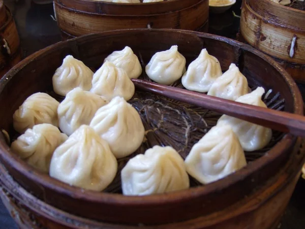 Shanghai xiaolongbao served in a bamboo steamer Shanghai xiaolongbao served in a bamboo steamer