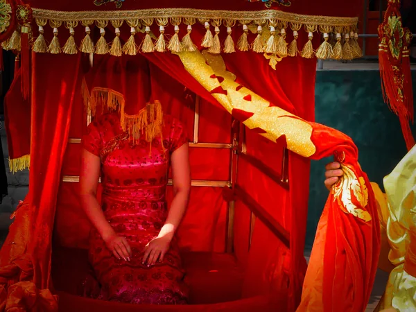 Traditional Chinese wedding ceremony with red attire