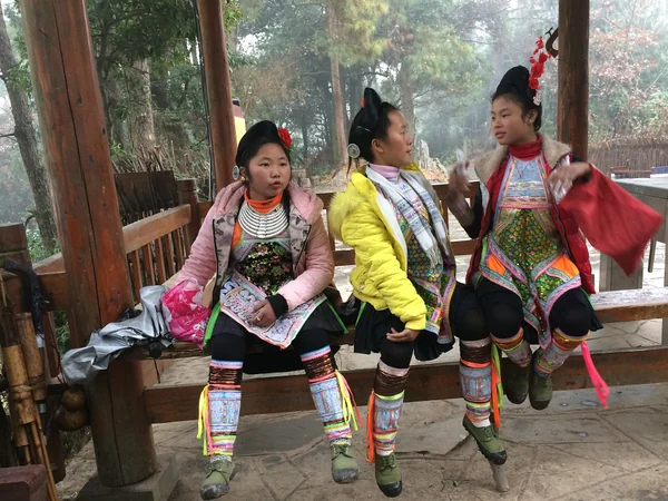 Baisha Miao women wearing embroidered clothing and silver ornaments in Guizhou