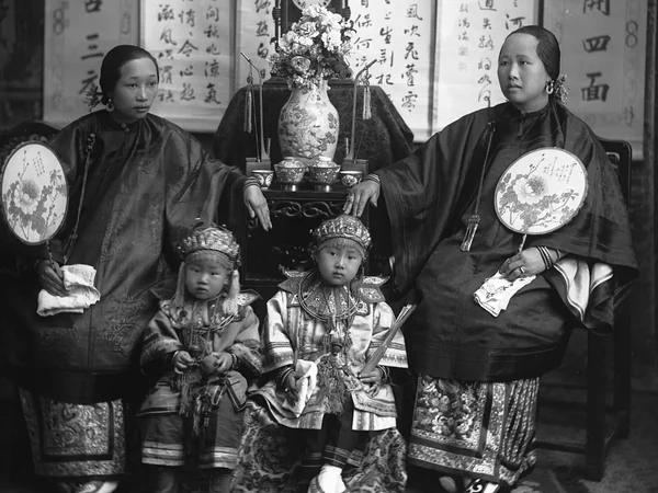 Historic photograph of a Chinese mother, daughter and children in formal dress Historic photograph of a Chinese mother, daughter and children in formal dress
