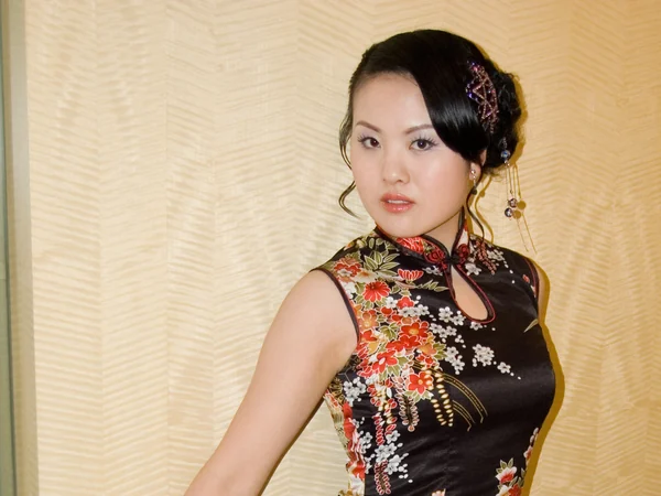 A fitted qipao showing a modern form of Chinese dress