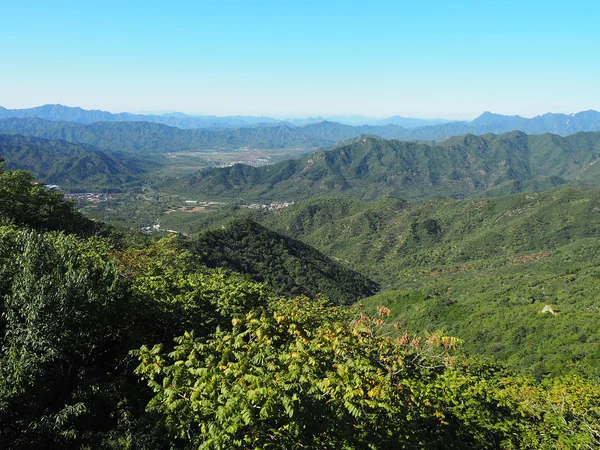 Real forested ridge and watchtowers at Mutianyu Great Wall Real forested ridge and watchtowers at Mutianyu Great Wall