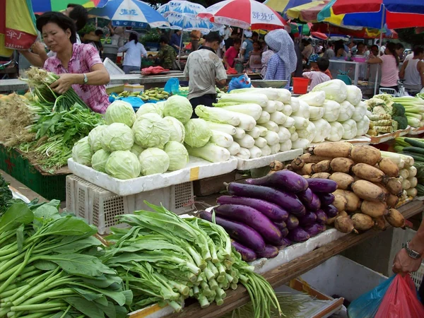 Vegetables and tofu products displayed at a Chinese food market