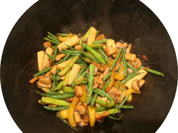 Cook stir-frying vegetables over high heat in a wok