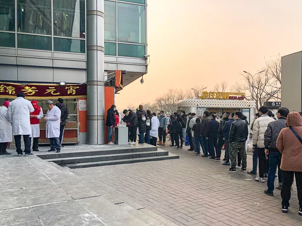 Customers queueing at food stalls on a Chinese snack street Customers queueing at food stalls on a Chinese snack street