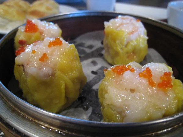 Assorted Cantonese dim sum served in bamboo steamers
