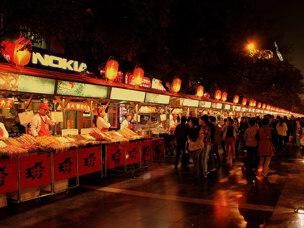 Cooked-food stalls at a night market in Beijing
