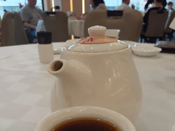 Traditional Chinese tea served in a small teapot and cups