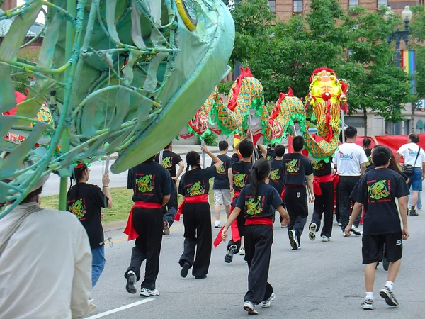 Performers carrying a long dragon costume during a Chinese festival