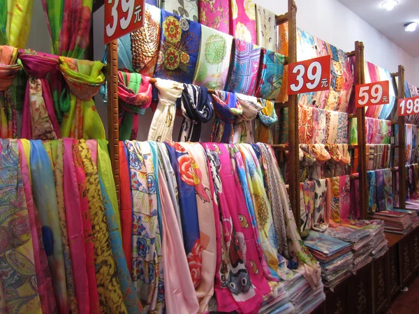 Colorful textiles for sale along Nanjing Road in Shanghai