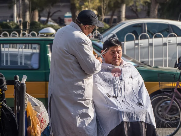 A haircut in China, illustrating a widely observed custom associated with Longtaitou