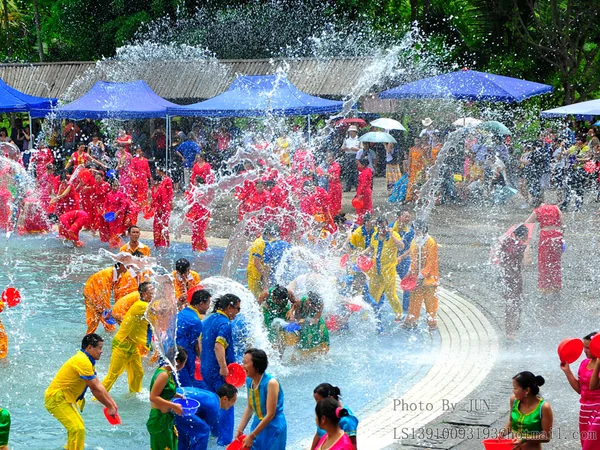 Participants splashing water during a Dai festival celebration in Yunnan Participants splashing water during a Dai festival celebration in Yunnan