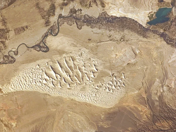 Astronaut view of dune fields and the Irtysh River in the Junggar Basin
