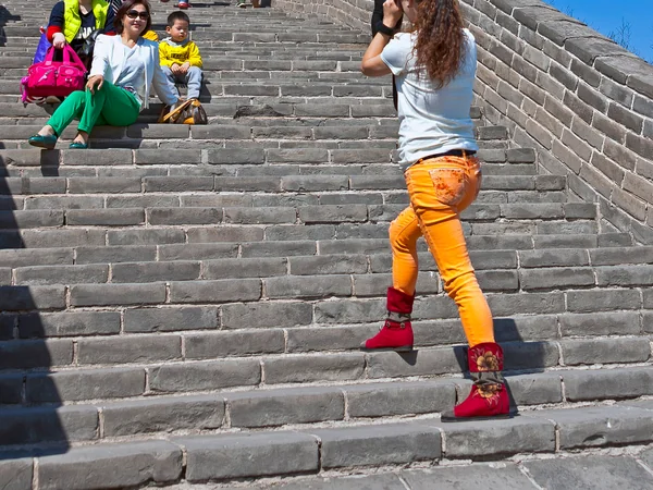 Visitors taking photographs while walking on the Great Wall Visitors taking photographs while walking on the Great Wall