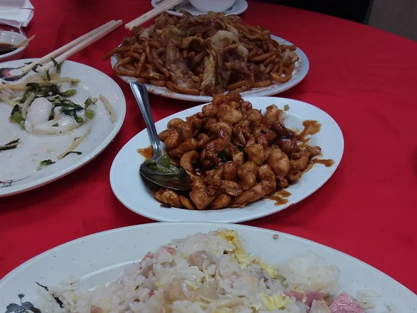 Diners eating together at a Shanghai-style restaurant in Hong Kong Diners eating together at a Shanghai-style restaurant in Hong Kong