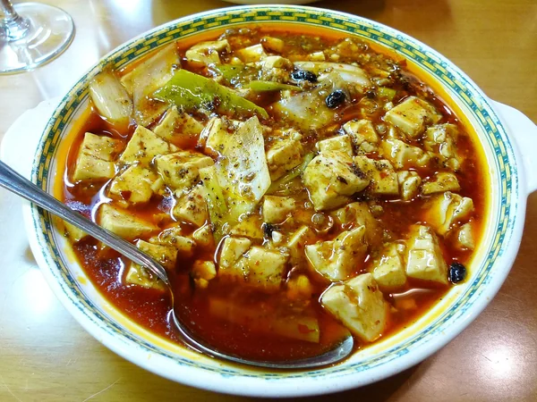 Mapo tofu served in a red chili-bean sauce Mapo tofu served in a red chili-bean sauce