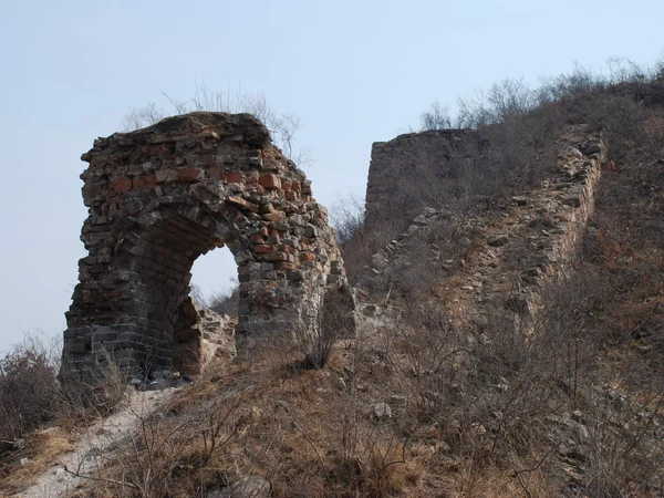 Weathered Ming watchtower in the Dongjiakou mountain landscape