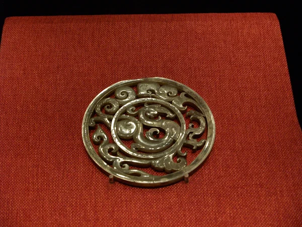 Ancient artifact decorated with a Chinese dragon motif
