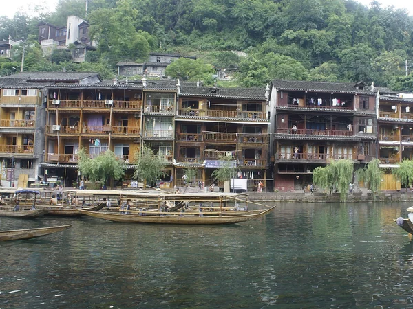 Timber diaojiaolou houses raised above the river in Fenghuang Timber diaojiaolou houses raised above the river in Fenghuang