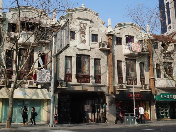 Stone-framed entrances along a historic shikumen lane in Shanghai