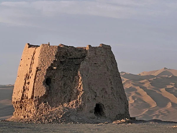 Han dynasty watchtower ruin beside ancient rammed-earth defenses in Dunhuang Han dynasty watchtower ruin beside ancient rammed-earth defenses in Dunhuang