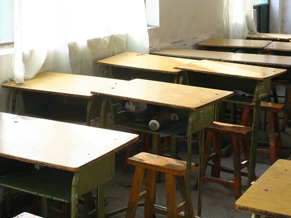 Desks and chalkboards in a school classroom for migrant students in Beijing Desks and chalkboards in a school classroom for migrant students in Beijing