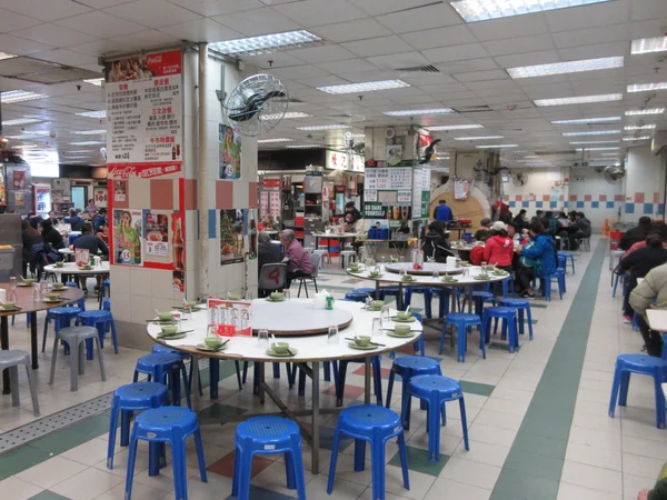 Round dining tables set for a shared meal in Hong Kong
