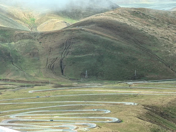 Mountain road crossing the Tibetan Plateau toward Everest Base Camp