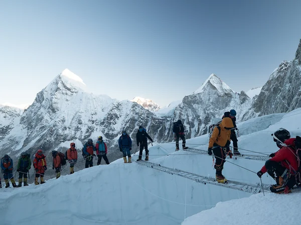 Climbers crossing crevassed glacier terrain on Mount Everest