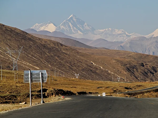 High plateau road near Tingri leading toward the Everest region High plateau road near Tingri leading toward the Everest region