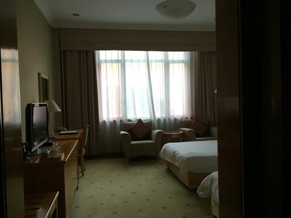A hotel room in China where bedding, bathroom access and location should be checked before booking