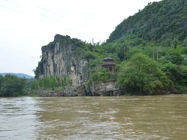 Karst scenery beside the Li River near Guilin, where boat duration and weather matter for families