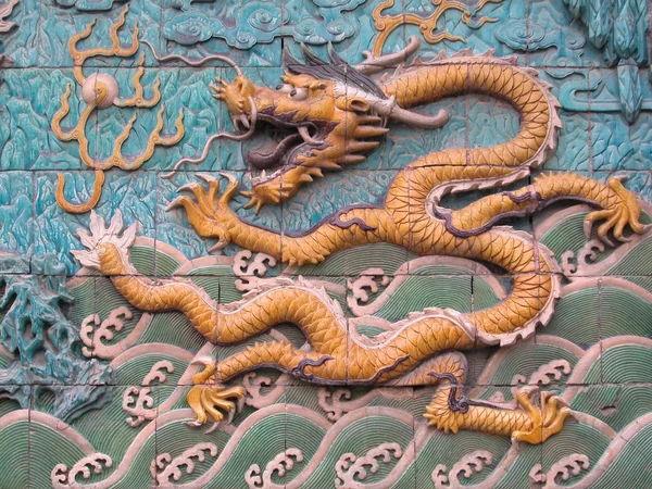 Glazed dragons moving through clouds on the Forbidden City Nine Dragon Wall