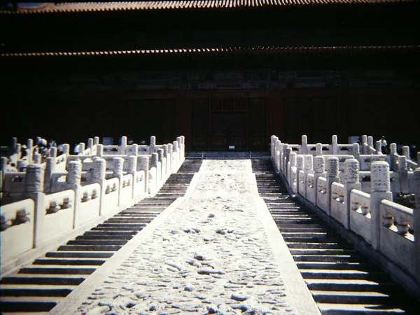 Dragons and clouds carved into the large imperial stone ramp at the Forbidden City