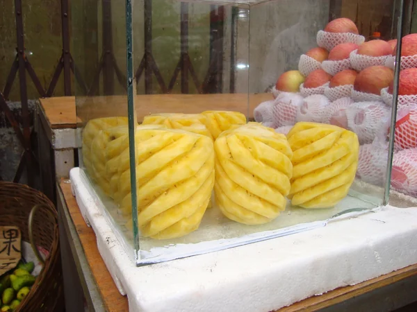 A fresh pineapple prepared for sale in Haikou A fresh pineapple prepared for sale in Haikou