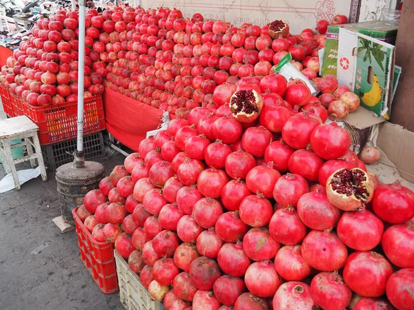 Ripe pomegranates showing their many red seeds Ripe pomegranates showing their many red seeds