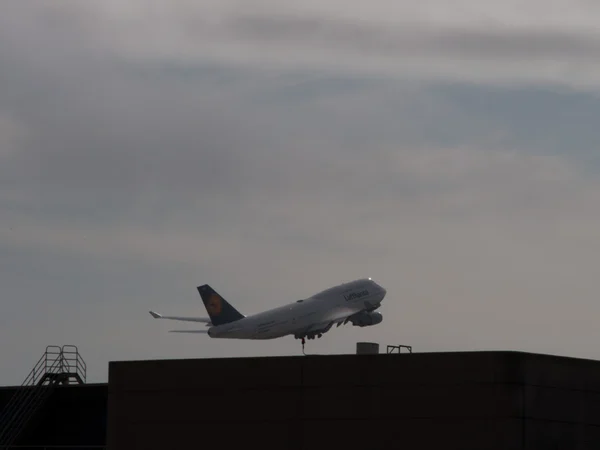 Passenger checking a Germany-to-China flight at Frankfurt Airport