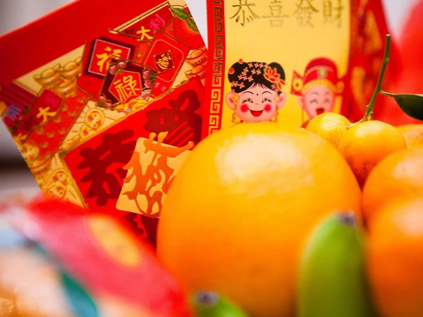 Red envelopes and fruit arranged as Chinese New Year gifts Red envelopes and fruit arranged as Chinese New Year gifts