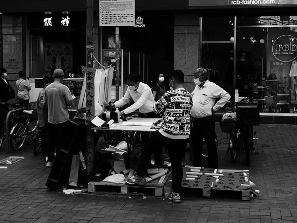 A calligrapher writing fai chun for Chinese New Year A calligrapher writing fai chun for Chinese New Year