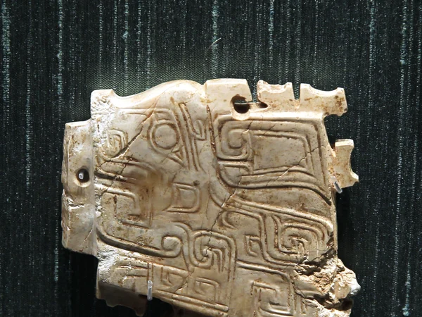 Shang dynasty jade pendant carved as a dragon-like creature