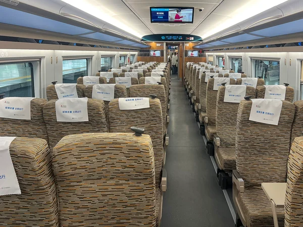 Passengers seated inside a modern high-speed train in China
