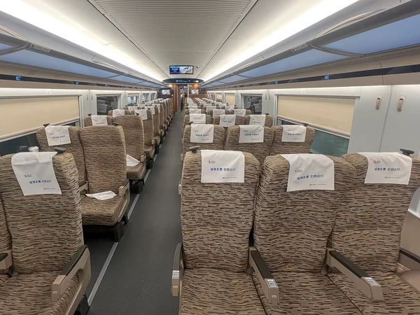 Passengers in a second-class high-speed train carriage in China Passengers in a second-class high-speed train carriage in China