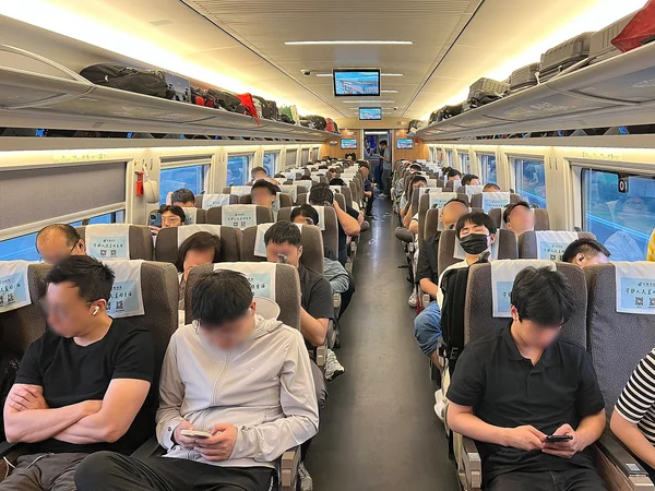 Second-class seating in a Chinese high-speed train carriage Second-class seating in a Chinese high-speed train carriage