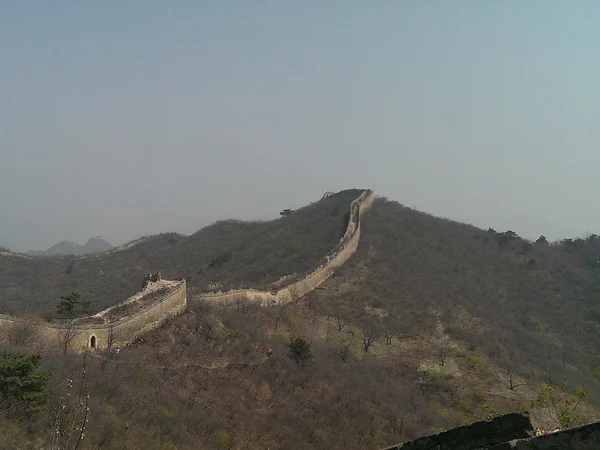 Huanghuacheng Great Wall crossing a hazy mountain ridge Huanghuacheng Great Wall crossing a hazy mountain ridge
