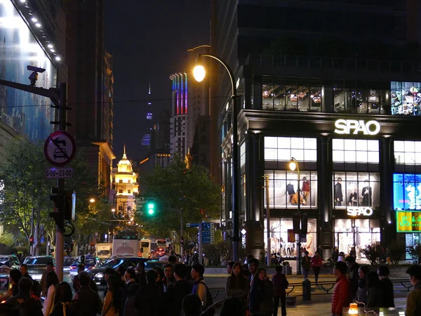 Travelers walking along Nanjing Road in central Shanghai