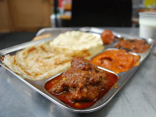 Indian curry and naan representing restaurant choices for a stay in Xian