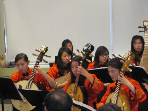 Traditional Chinese instruments performed by an orchestra Traditional Chinese instruments performed by an orchestra