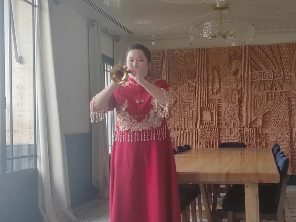 Musician playing the bright-toned Chinese suona